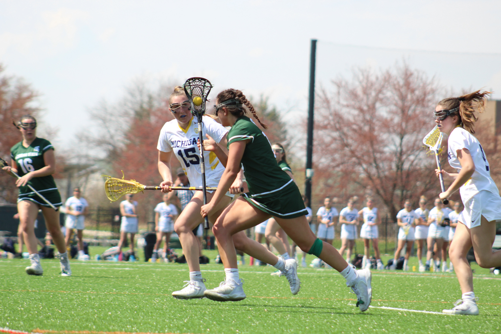 Womens Lacrosse playing on Spartan Greens