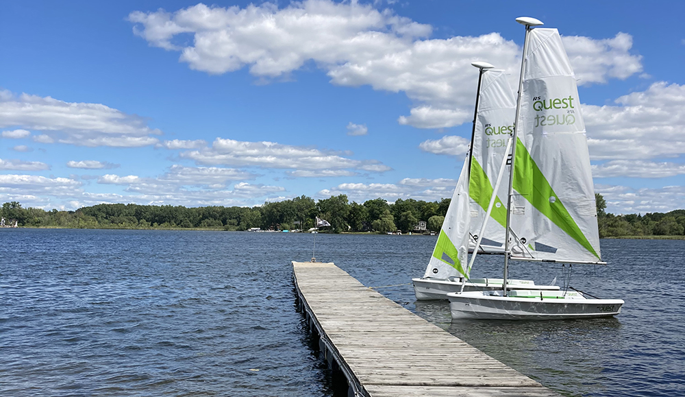 RS Quest sail boat docked on Lake Lansing