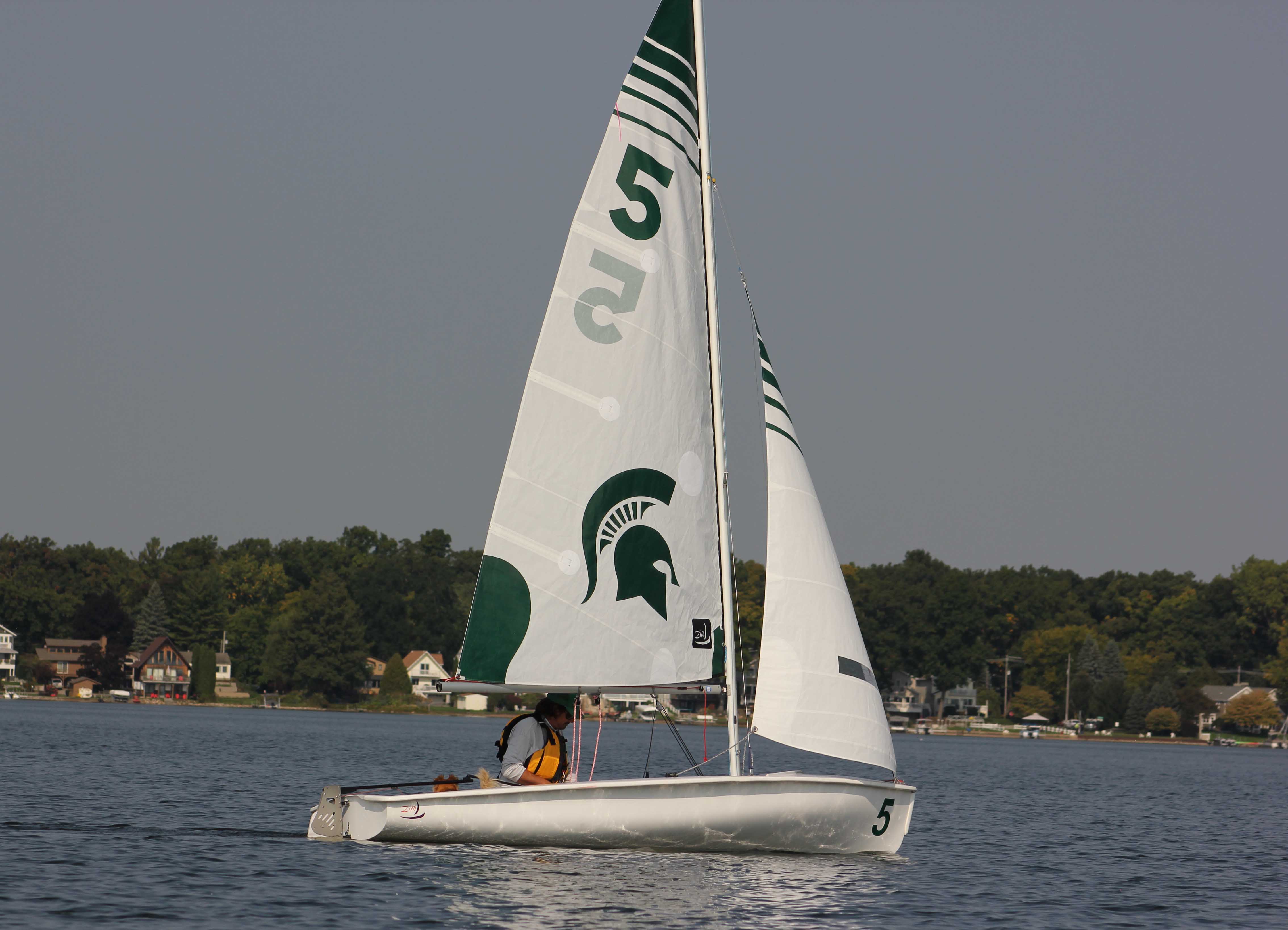 ZIM 420E Sail boat with green and white sails on Lake Lansing