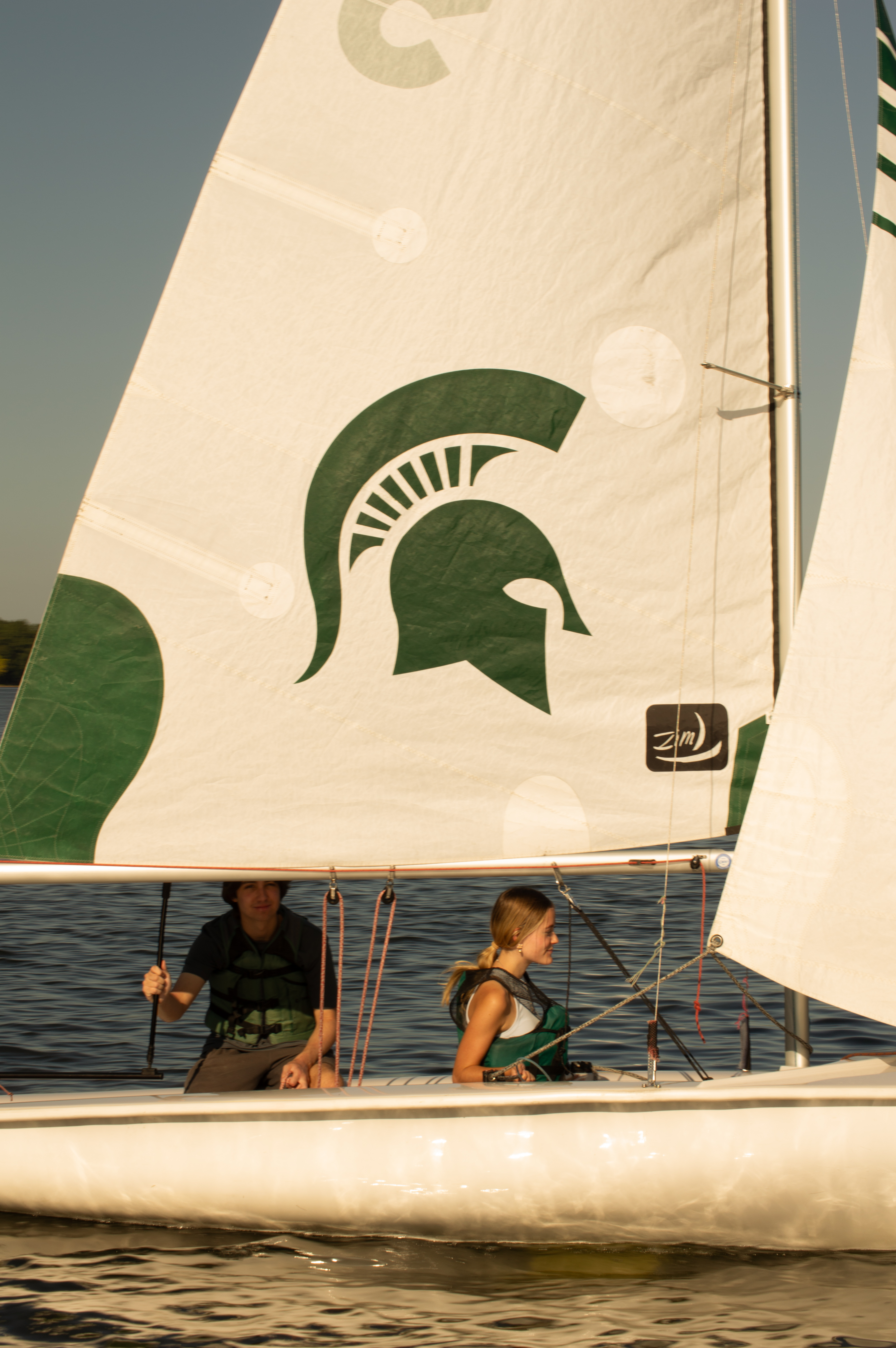A pair sails on Lake Lansing in one of the MSU Sailing Center's sailboats